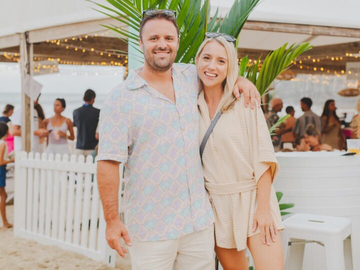 Josh & Laura at an event on Noos aMain beach showing off their Marquee Hire Pavillions
